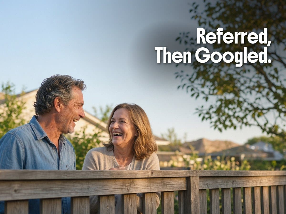 A smiling couple leans on a wooden deck rail in a backyard, beside the words Referred, Then Googled.